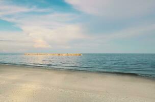 Landscape of beach and sea in Thailand with white sand and blue sky photo