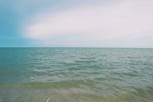 Landscape of beach and sea in Thailand with white sand and blue sky photo