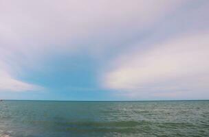 Landscape of beach and sea in Thailand with white sand and blue sky photo