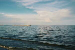 Landscape of beach and sea in Thailand with white sand and blue sky photo