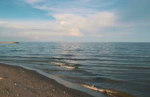 Landscape of sea and beach during sunset night time with vanilla sky photo