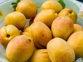 Ripe pineapple apricots. Fruits. Ecological food background. Healthy eating concept. photo