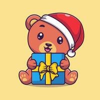 Vector cute bear holding gift box for christmas day cartoon vector icon illustration