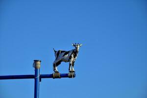 goat decoration on a background of the blue sky on the Spanish island of Fuertaventura symbol photo