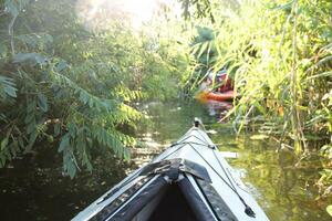 Sundown Kayaking, Active River Adventure amidst Glowing Sunset, Embracing Outdoor Thrills and Tranquil Retreat photo