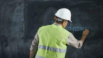 Engineer man writes Thermodynamics on the board. video