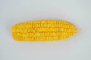 Peeled corn on a white background. Sweet corn vegetables, fresh peeled saw yellow corn kernels. photo