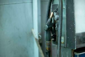 Vintage Oil dispenser. Abandoned fuel pump with old oil dispenser. photo