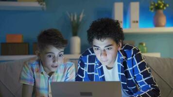 Two young friends are stressing out while researching something on the laptop. video