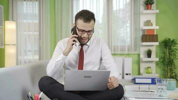 Happy and cheerful businessman making a phone call. video