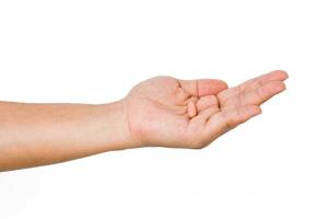 Hand holding a capsule or pill isolated on white background. photo