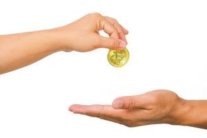 Female hand giving golden bitcoin to male hand on white background. Business Saving Finance and Investment concept. photo