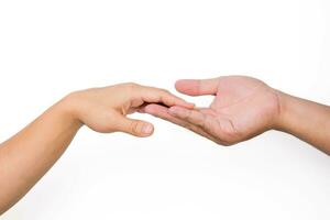 Hands of man and woman reaching to each other. Two people holding hands on white background. That can mean helping, caring, protecting, loving, caring and world peace concept. photo