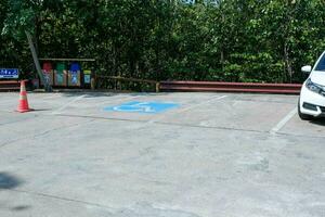 View of handicapped parking in a tourist attraction in Thailand. Parking with a special place for the disabled. photo