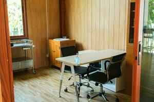 Medical professional workspace with table and first aid equipment in room. medicine and healthcare concept photo