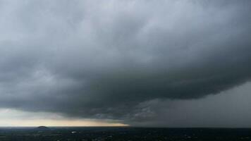 Aerial view of dark sky clouds background. Dark gray storm clouds before the storm. Beautiful nature of storm clouds in the daytime. Horrible weather photo