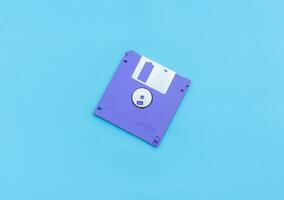 Floppy disk isolated on blue backgorund. After some edits. photo