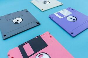 Floppy disks isolated on blue background. After some edits. photo