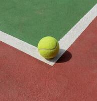 Tennis ball on the court, after some edits. photo