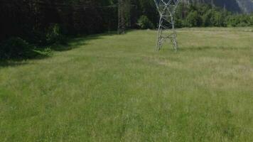 a mountain range with a power line and trees video