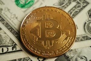 Golden bitcoin on US dollar banknotes money for business and commercial, Digital currency, Virtual cryptocurrency, blockchain technology. photo