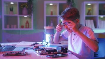 Little boy trying to fix the electronic board. Technology enthusiast. video