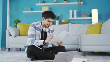 Successful and focused young man studying at home. video