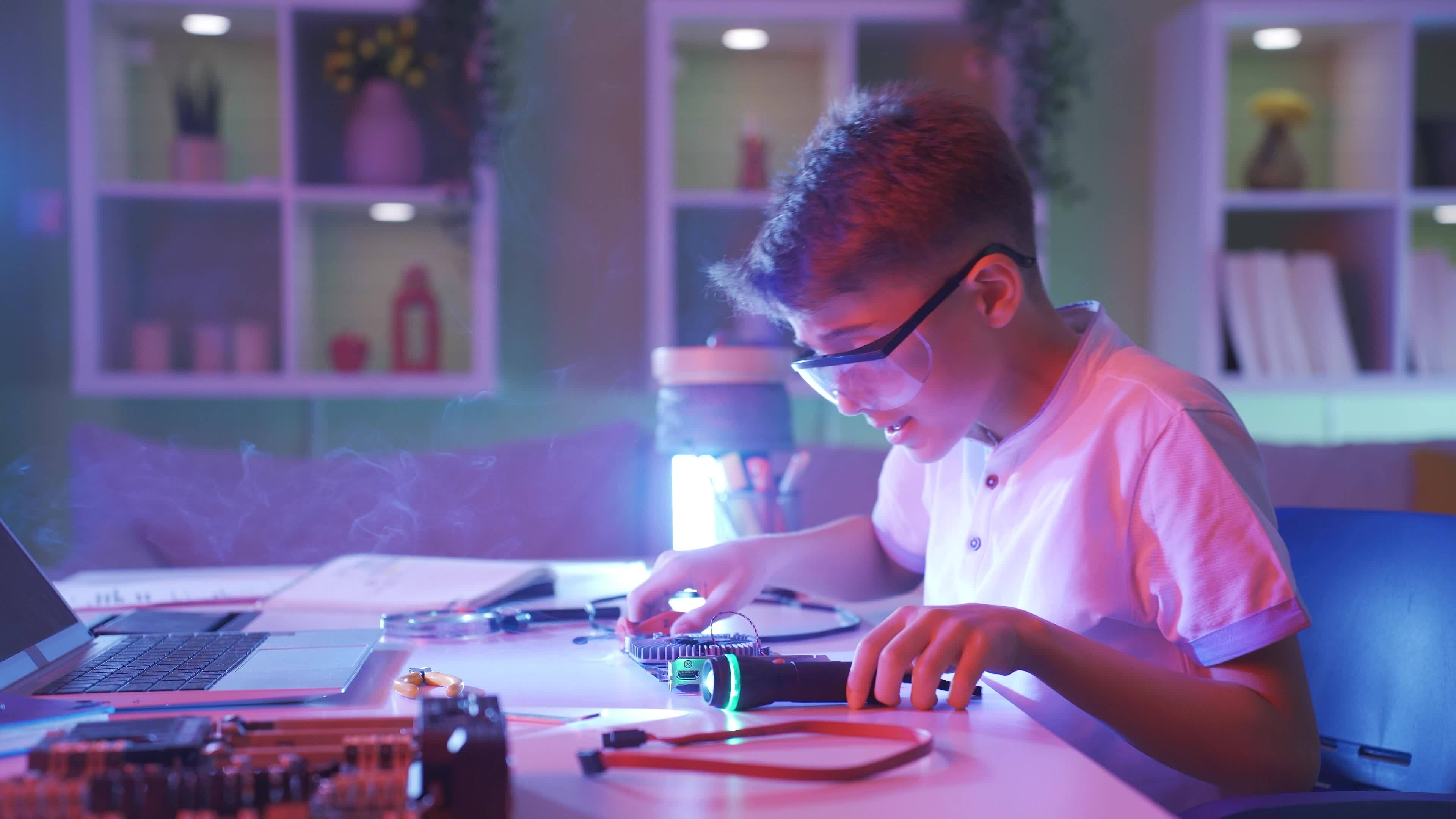 The boy who damaged the computer part. Smoke comes out of the