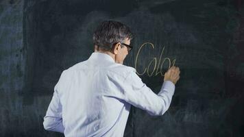 Engineer man writes Column on the board. video