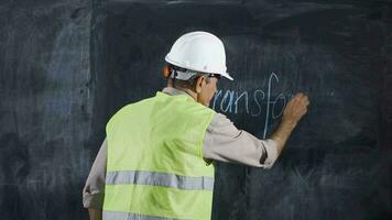 Engineer man writes Transformer on the blackboard. video