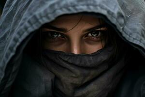 woman with gloves on covering his face in winter in a city on the fashion style bokeh background photo