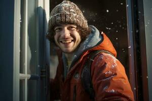 A man in a winter coat opens the door to welcome his neighbors at Christmas photo