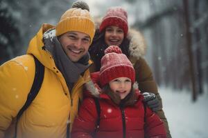 A family in winter clothes stands and chats in front of a house in winter photo