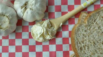 top view of garlic spread on a spoon video