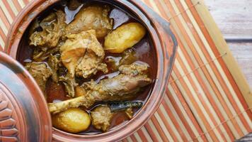 Chicken curry or masala in a bowl on table video