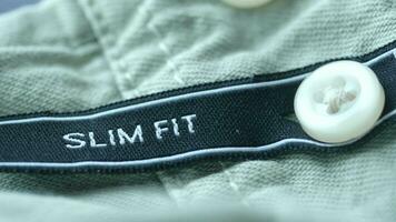 label tag slim fit on a men shirt video