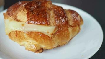 fresh baked croissant on plate with copy space video