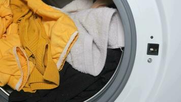 close up of cloths in a washing machine. video