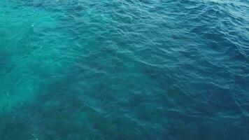 aerial view of blue sea water surface texture. Aerial view of turquoise sea water. Water surface texture video