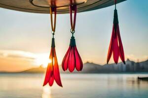 red flowers hanging from a metal pole in the water. AI-Generated photo