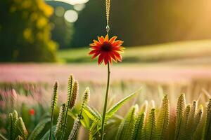 a red flower is hanging from a chain in a field. AI-Generated photo