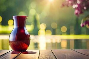 a red vase sitting on a wooden table near a pond. AI-Generated photo