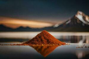 a pile of red powder sitting on the water with mountains in the background. AI-Generated photo