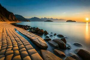 the sun sets over a beach with rocks and water. AI-Generated photo