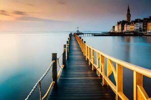 a wooden pier leads to a town at sunset. AI-Generated photo