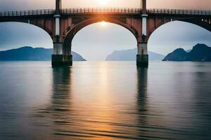 un puente abarcando terminado agua a puesta de sol. generado por ai foto