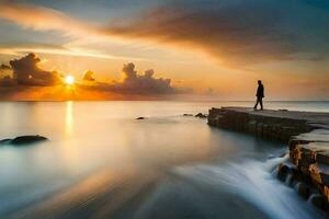 un hombre soportes en un rock a puesta de sol. generado por ai foto