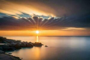 puesta de sol terminado el Oceano con rocas y agua. generado por ai foto