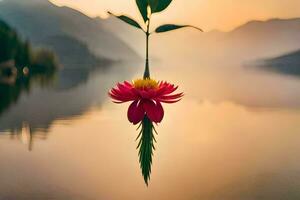 a flower hanging from a tree in front of a lake. AI-Generated photo