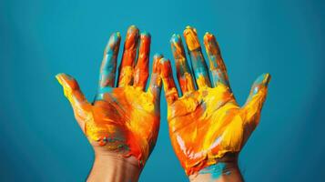 Young hands creating expressive art isolated on a vibrant gradient background photo